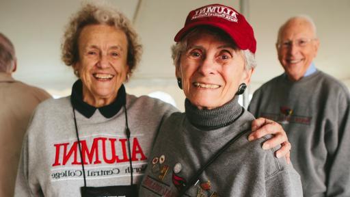 alumni in tailgate tent